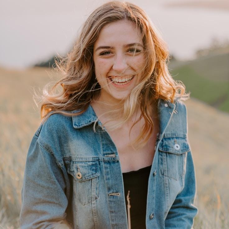 Avery Singh, Lead Design Curator at Open Meadow Chart, reviewing corporate floral arrangements